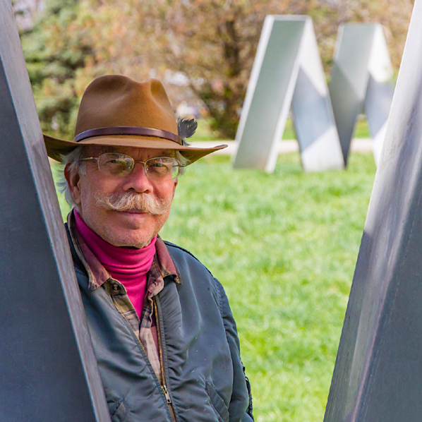 jon hudson with large fluid dynamics sculpture in Dayton, OH